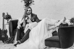 Modern Rock N Roll Wedding, Bride and Groom Wearing Sunglasses Lounging on Couch | Tampa Bay Wedding Photographer Amanda Zabrocki Photography | Styled Shoot