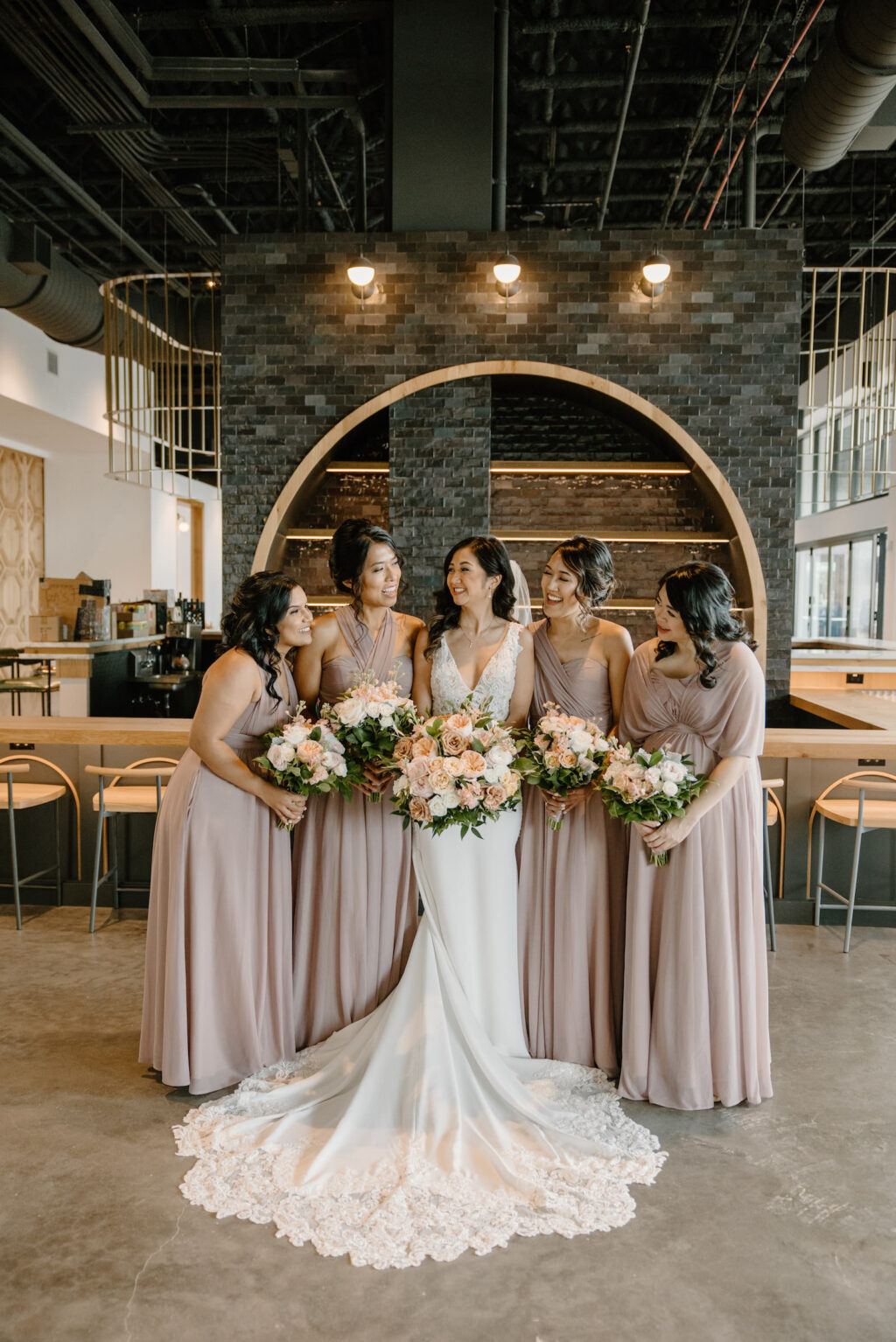 Modern Boho Bride Wearing Lace Train and Crepe Wedding Dress and Bridesmaids in Mauve Mix and Match Dresses | Unique South Tampa Wedding Venue Hyde House | Wedding Hair and Makeup Adore Bridal | Wedding Florist Iza's Flowers