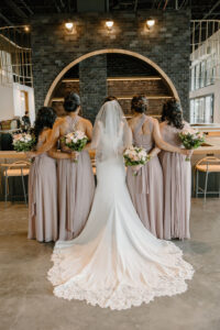 Modern Boho Bride Wearing Lace Train and Crepe Wedding Dress and Bridesmaids in Mauve Mix and Match Dresses | Unique South Tampa Wedding Venue Hyde House | Wedding Hair and Makeup Adore Bridal | Wedding Florist Iza's Flowers