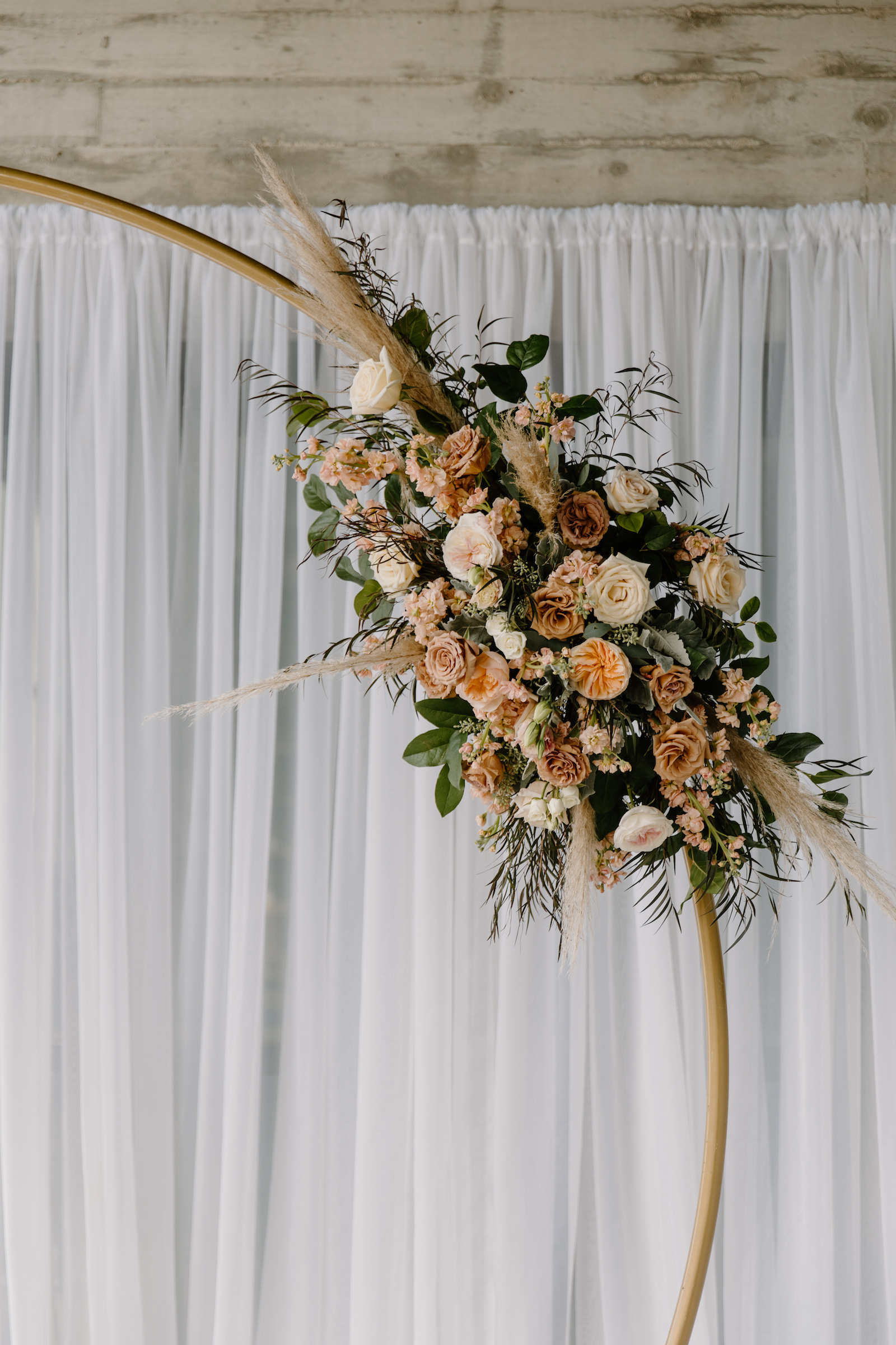 Modern Boho Wedding Ceremony Decor, Gold Metal Circular Arch with Lush Burnt Orange, Ivory and Blush Pink Roses with Pampas Grass and Eucalyptus Greenery Floral Arrangement | Tampa Bay Wedding Florist Iza's Flowers
