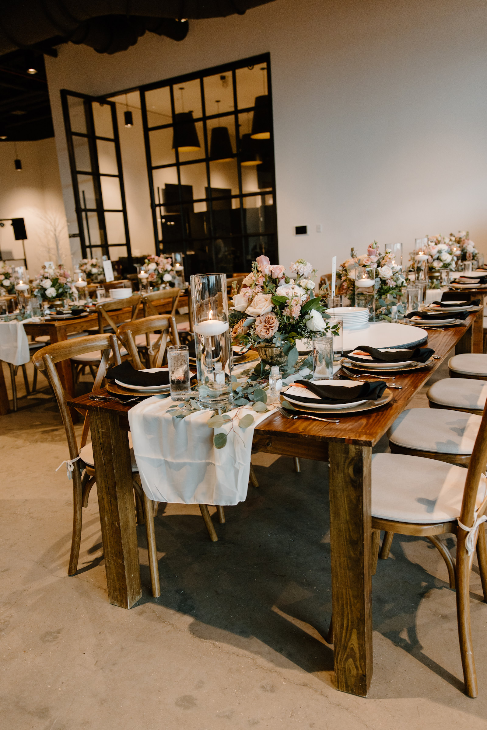 Neutral Modern Boho Wedding Reception Decor, Long Wooden Feasting Tables with Wooden Cross Back Chairs, White Linen Table Runner, Low Floral Centerpieces | Unique South Tampa Wedding Venue Hyde House | Wedding Florist Iza's Flowers