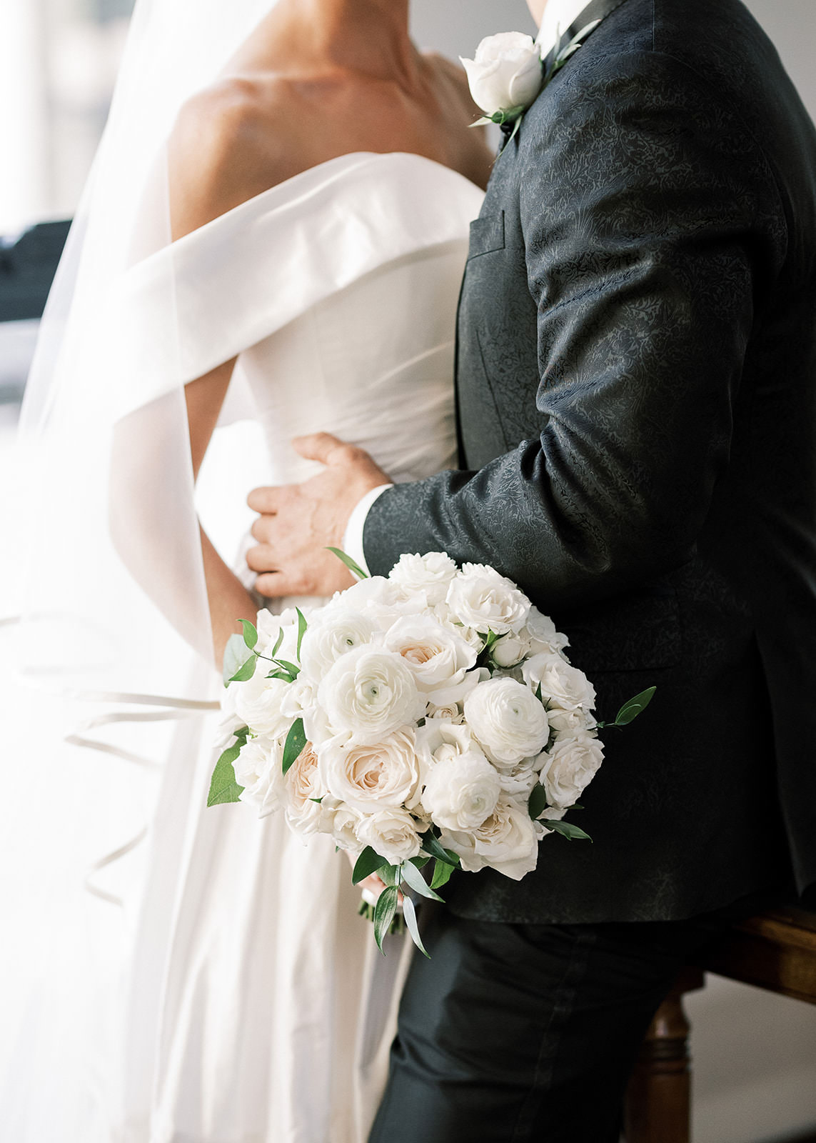 Classic Bride Holding All White Roses and Greenery Floral Bouquet and Groom Wedding Portrait | Tampa Bay Wedding Florist Botanica International Design Studio