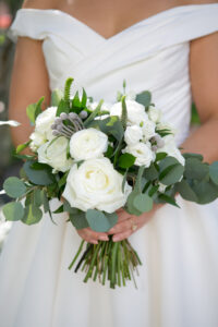 Green and Gold Christmas Wedding, Bride Holding White Roses, Eucalyptus and White Berry Floral Bouquet | Tampa Bay Wedding Photographer Carrie Wildes Photography