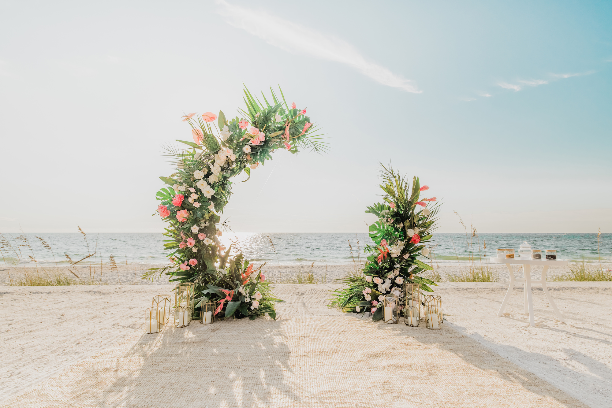 Half Circle Wedding Arch with Pink and Beach Florals and Greenery