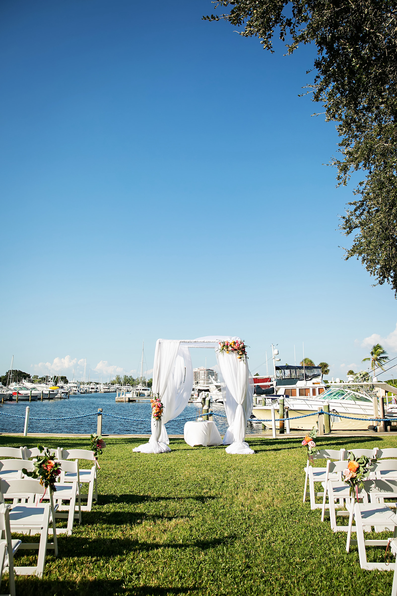 Waterfront Wedding Ceremony with Bright Vibrant Florals | Florida Waterfront Wedding Venue The Resort at Longboat Key