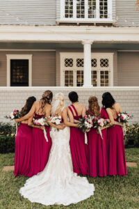 Warm Romantic Neutral Wedding, Bride Wearing Lace and Illusion with Nude Lining Wedding Dress, Bridesmaids Wearing Mix and Match Berry Dresses, Maid of Honor Wearing Champagne Dress Holding Lush White Roses, Blush Pink, Berry and Purple Floral Bouquets