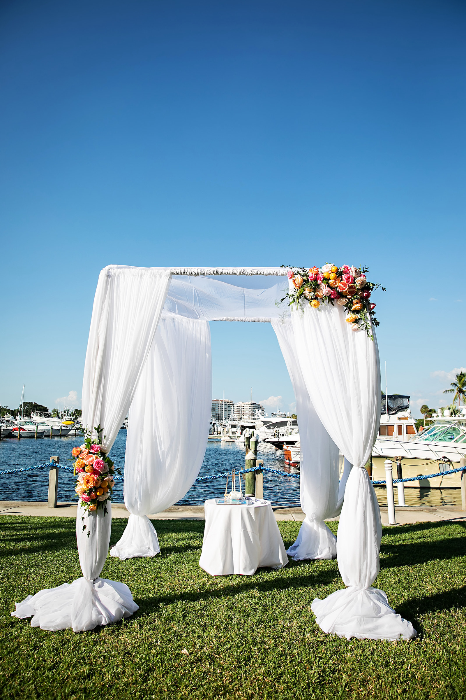 Waterfront Wedding Ceremony with Bright Vibrant Florals | Florida Waterfront Wedding Venue The Resort at Longboat Key