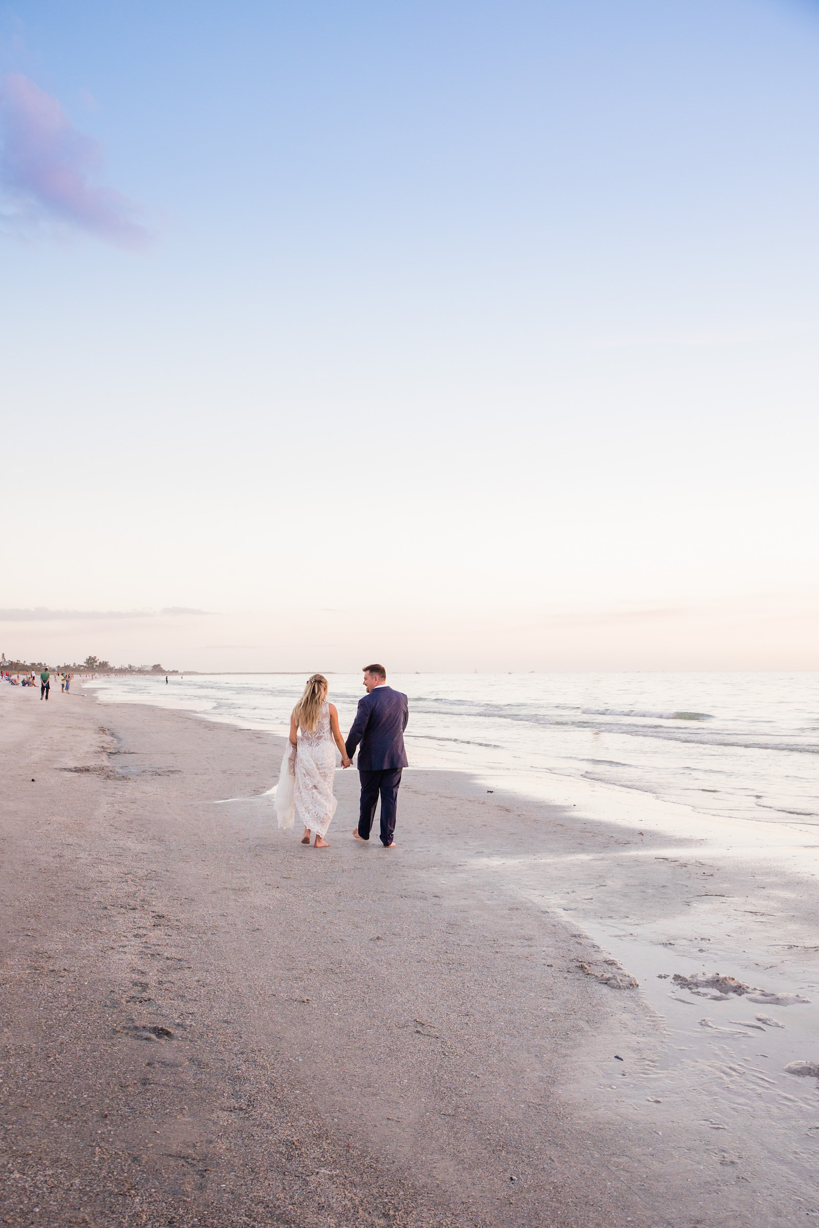 Florida Bride and Groom Walking on Beach Sunset Wedding Portrait