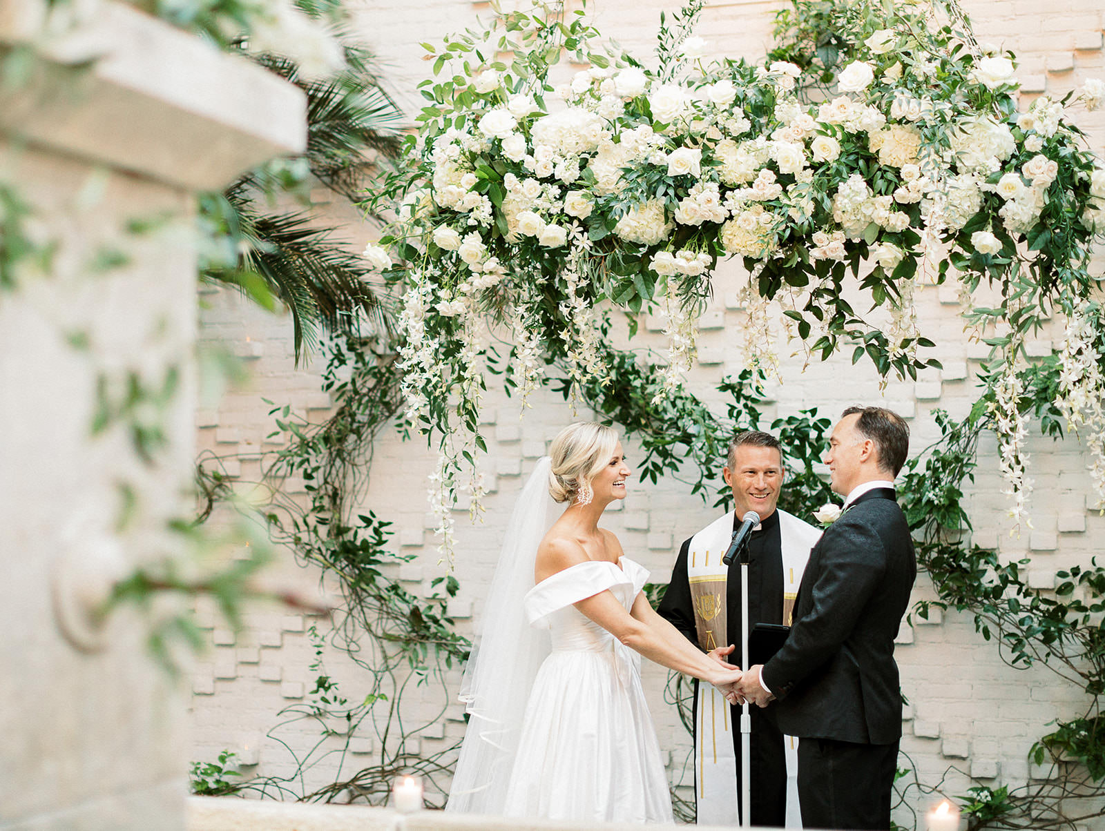 Classic Elegant Bride and Groom Exchanging Wedding Vows, Hanging Lush White Flowers with Greenery | Tampa Bay Wedding Florist Botanica | South Tampa Wedding Venue Oxford Exchange