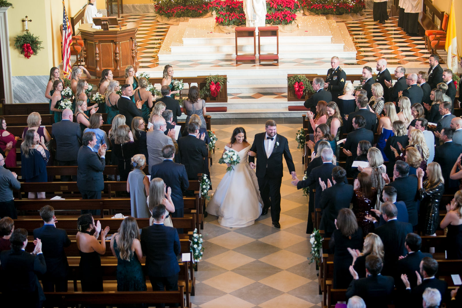 Green and Gold Christmas Wedding, Bride and Groom Exchanging Wedding Vows During Ceremony | Tampa Bay Wedding Photographer Carrie Wildes Photography | Traditional Church Wedding Venue Jesuit High School: Chapel of the Holy Cross