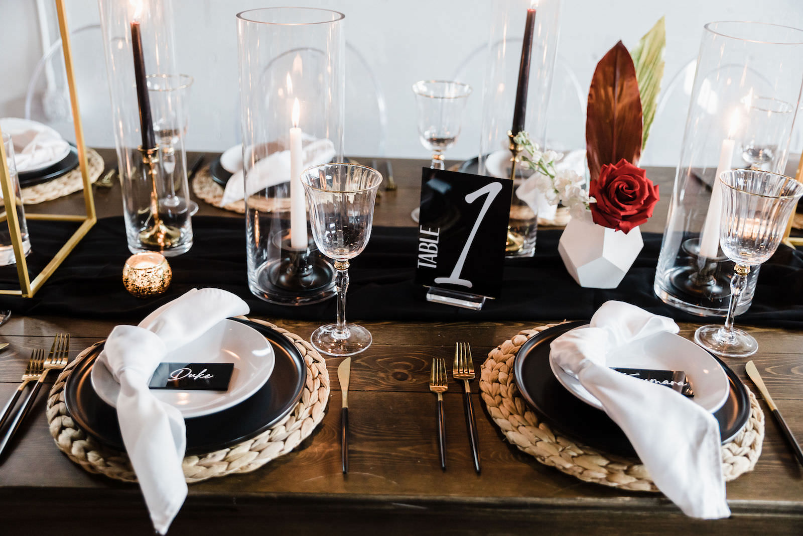Black Plating with Woven Chargers and Gold Flatware | Black Acrylic Table Numbers | Gabro Event Rental Services