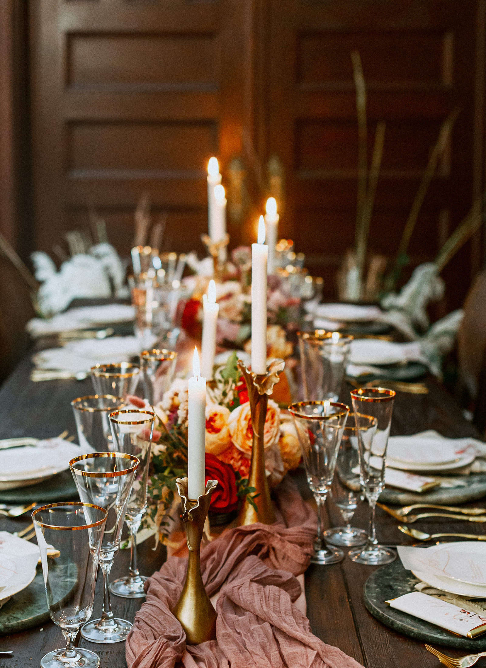 Vintage European Wedding Decor, Long Feasting Wooden Table, Gold Candlesticks, Mauve Linen Table Runner, Red and Orange Roses Floral Centerpiece | Tampa Bay Wedding Photographer Dewitt for Love