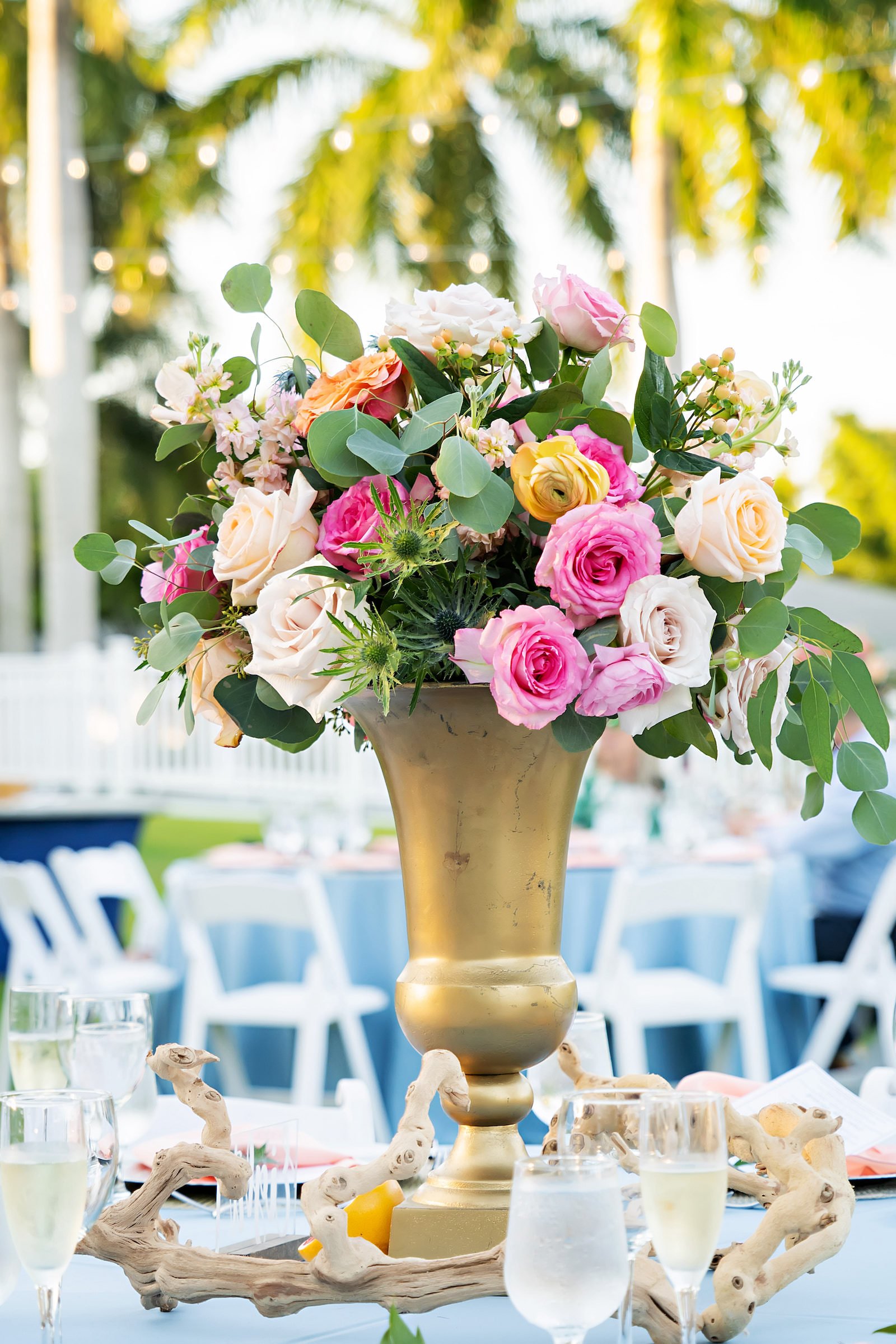 Pink and Orange Floral Centerpieces in Gold Vase with Greenery