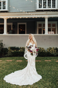 Warm Neutral Fall Wedding, Bride Wearing Lace and Illusion with Nude Lining Wedding Dress Holding Lush White and Berry Colored Floral Bouquet Beauty Wedding Portrait | Tampa Wedding Venue The Orlo