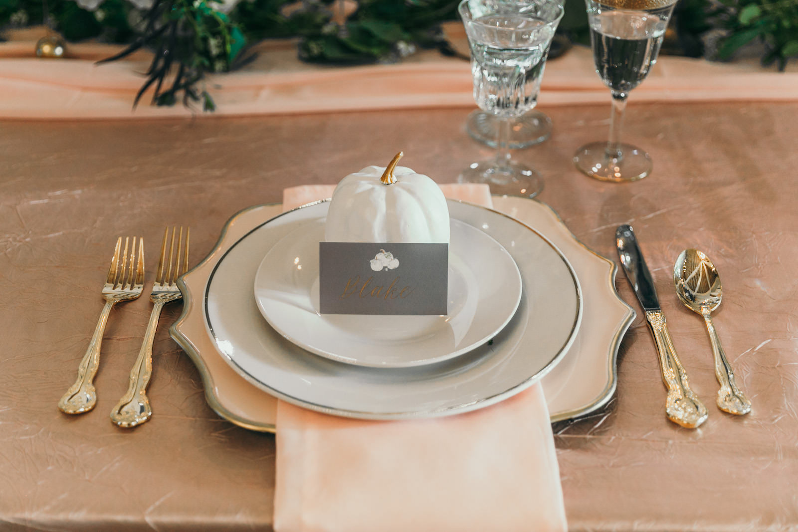 Place Setting with Pale Pink and White Charge and Gold Flatware | White Pumpkin Décor with Place Card