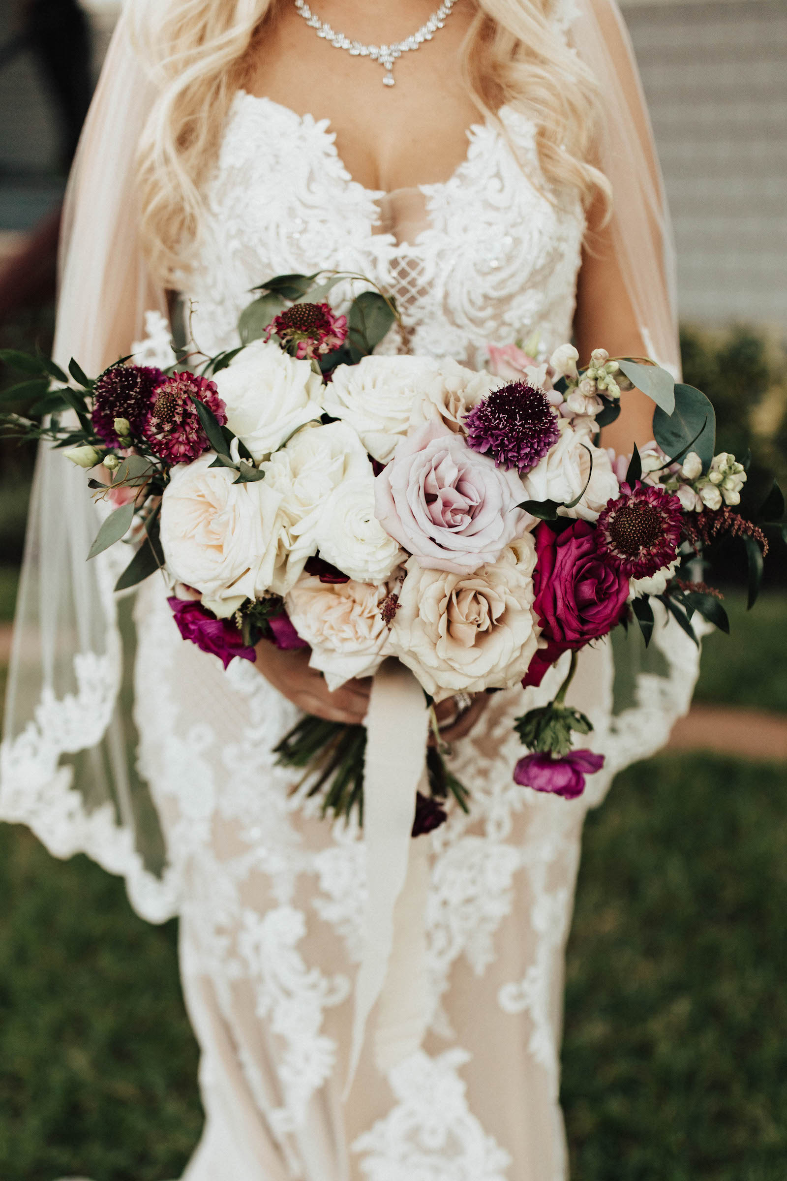 Warm Neutral Fall Wedding, Bride Wearing Lace and Illusion with Nude Lining Wedding Dress Holding Lush White Roses and Berry Colored Floral Bouquet with Greenery Beauty Wedding Portrait | Tampa Wedding Venue The Orlo