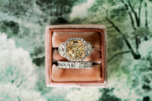 Yellow Cushion Cut Halo and Two Side Stones, Bride Diamond Wedding Ring in Mauve Ring Box | Tampa Bay Wedding Photographer Dewitt for Love