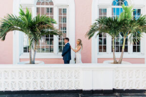 Elegant Navy Wedding, Bride and Groom First Look Portrait on Balcony of St. Pete Wedding Historic Venue The Don CeSar