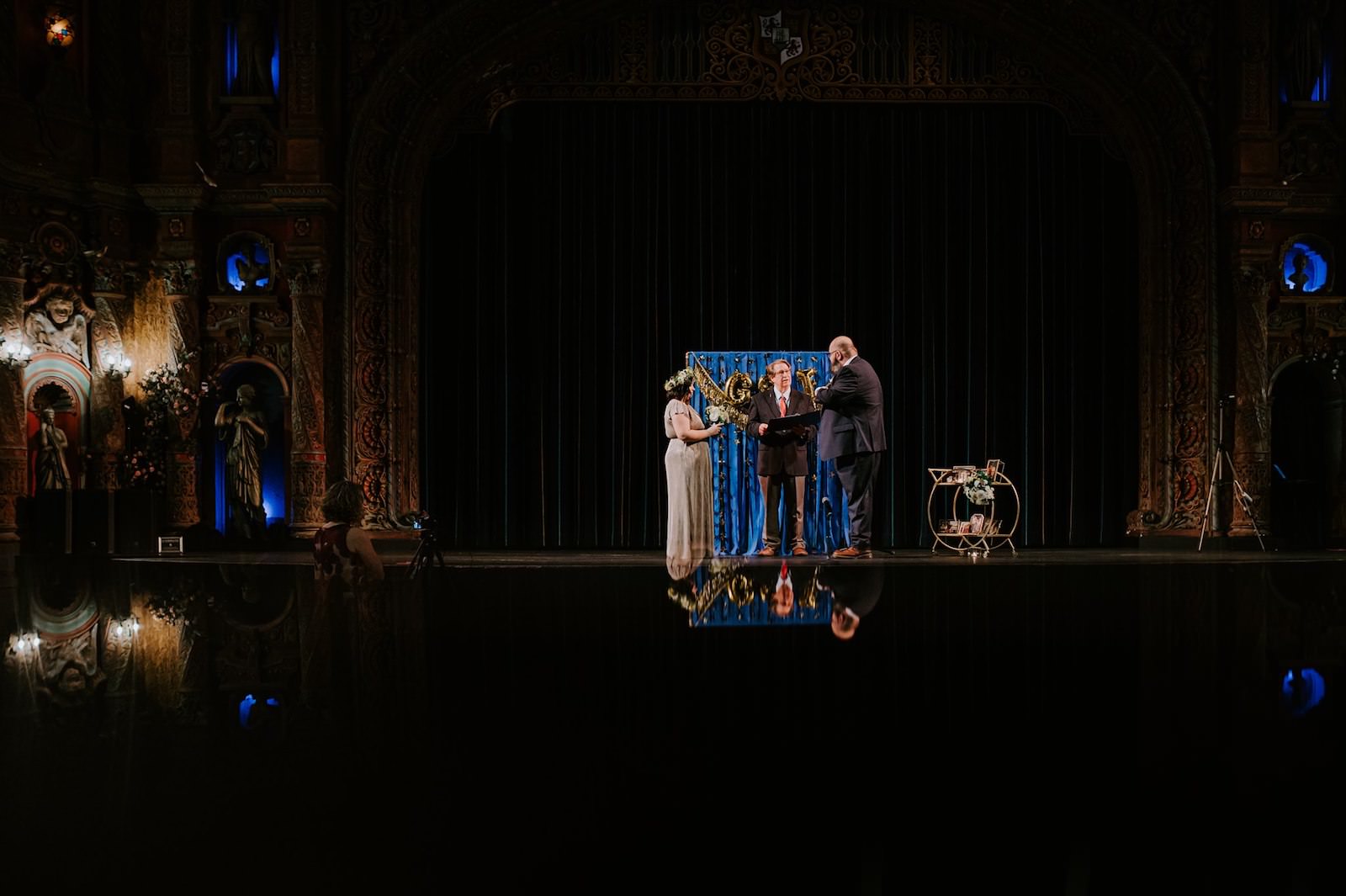 Bride and Groom Exchange Vows in Tampa Theatre | Florida Wedding Photographer Regina as the Photographer