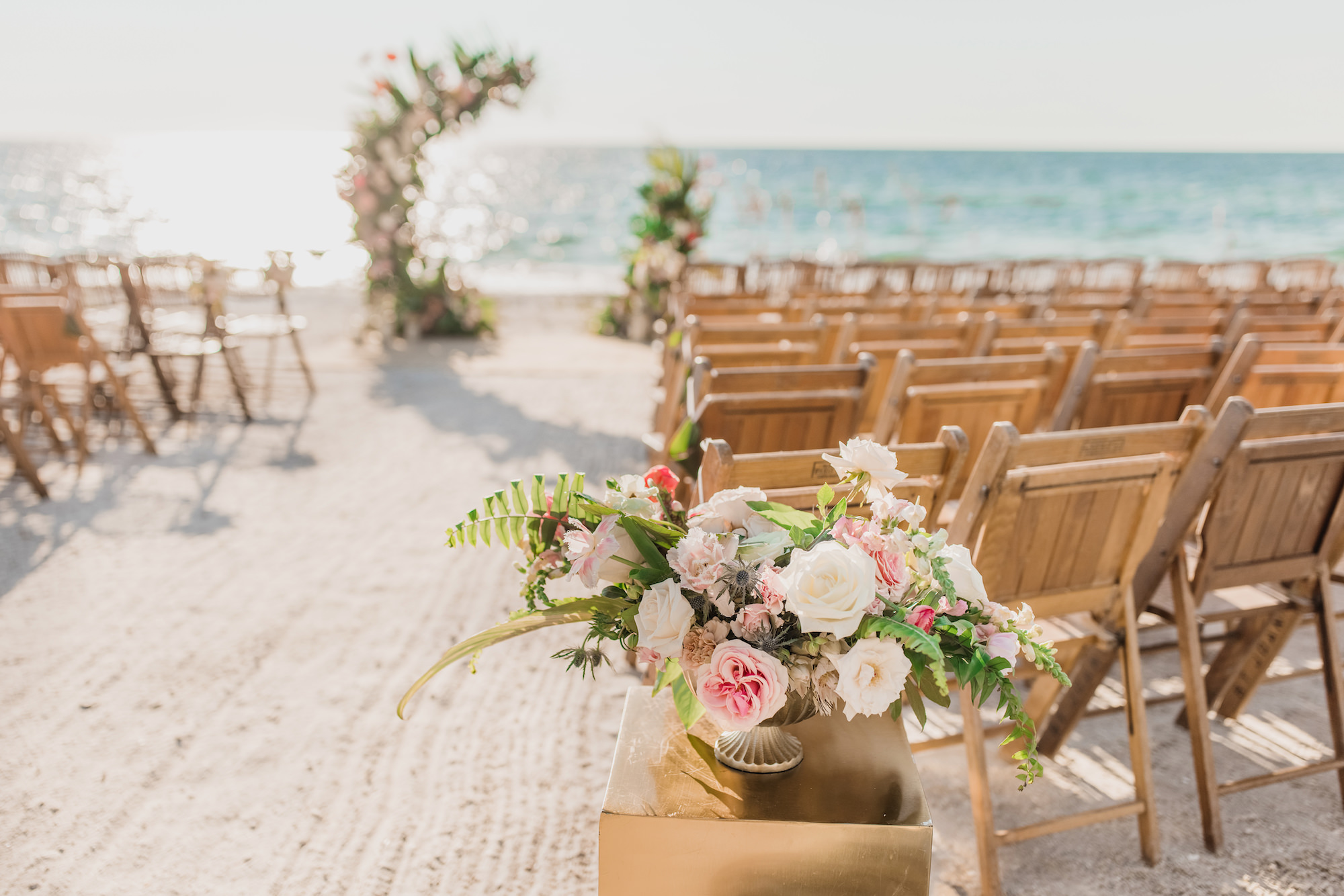 Beach Front Half Circle Arch Wooden Folding Chairs and Pink Florals with Greenery