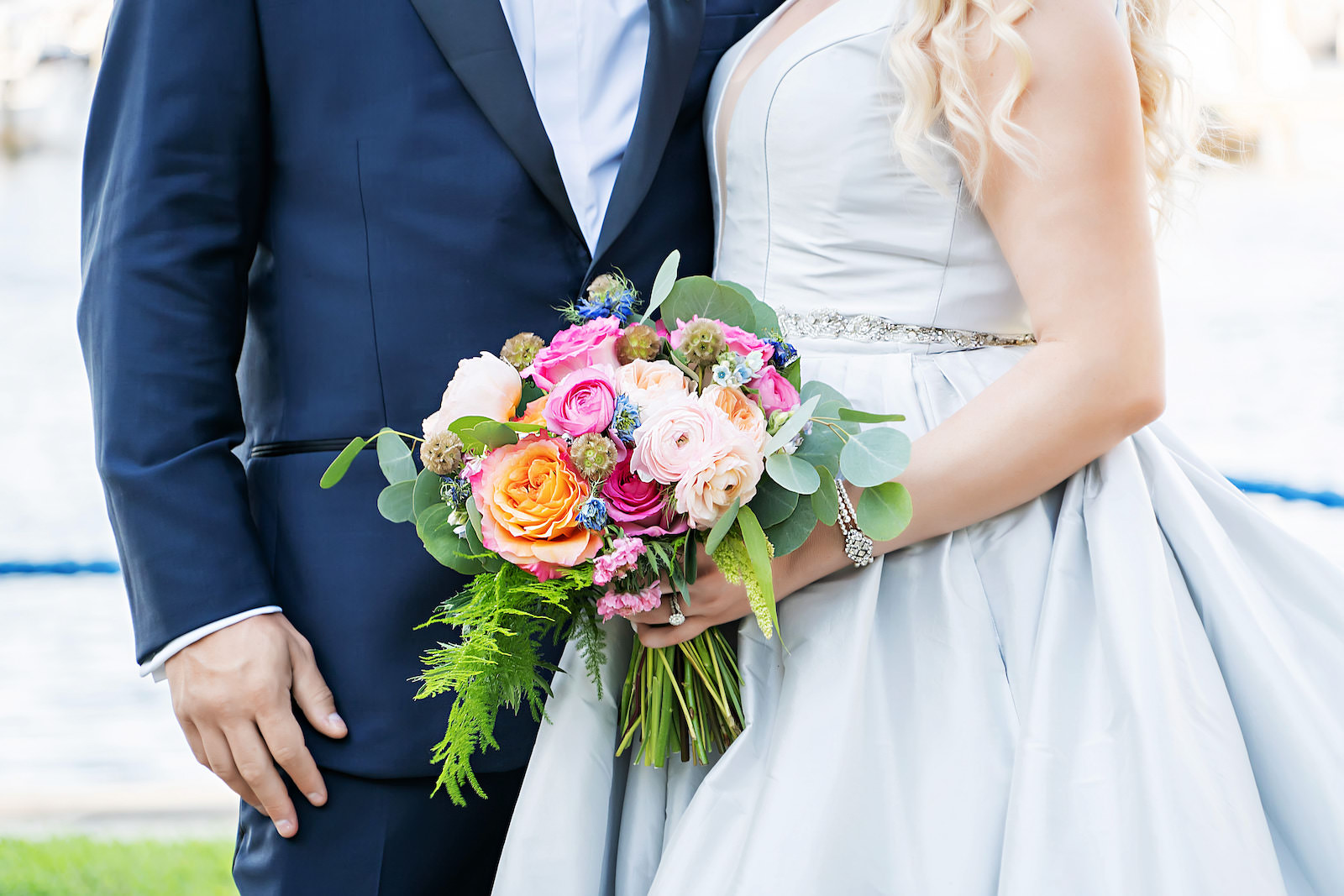 Bride and Groom Close Up Wedding Bouquet with Orange and Pink Bright Florals Wedding Portrait | Florida Photographer Limelight Photography