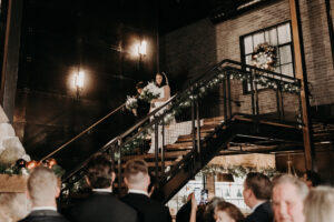 Bride Walking Down Industrial Staircase Aisle Wedding Portrait | Tampa Venue Urban Stillhouse