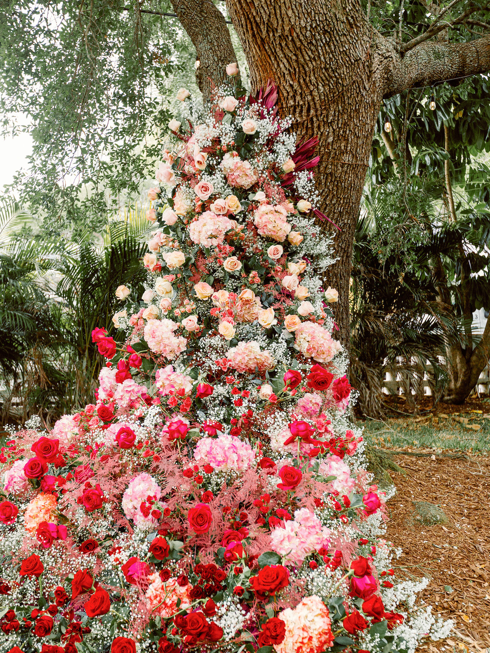 Fairytale Wedding Ceremony Decor, Lush Red, Pink Roses, Hydrangeas, Altar Flower Arrangement | Tampa Bay Wedding Photographer Dewitt for Love Photography | Wedding Florist Lemon Drops