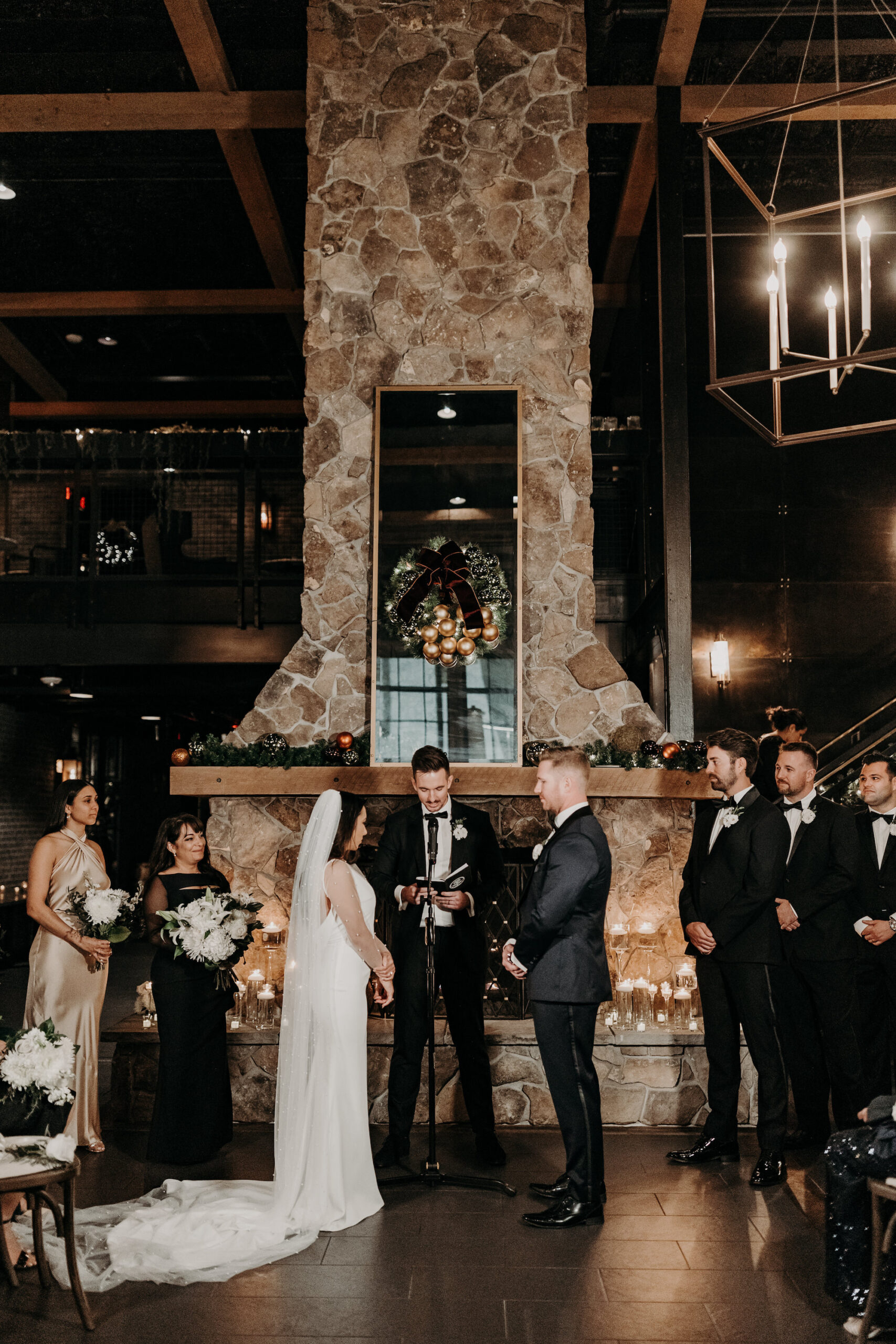 Bride and Groom Exchanging Vows in Dark and Moody Industrial Wedding Ceremony | Florida Wedding Venue Urban Stillhouse