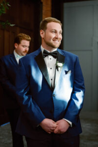 Groom Reaction to Bride Walking Down Aisle | Navy Suit Tuxedo Black Lapel Bowtie