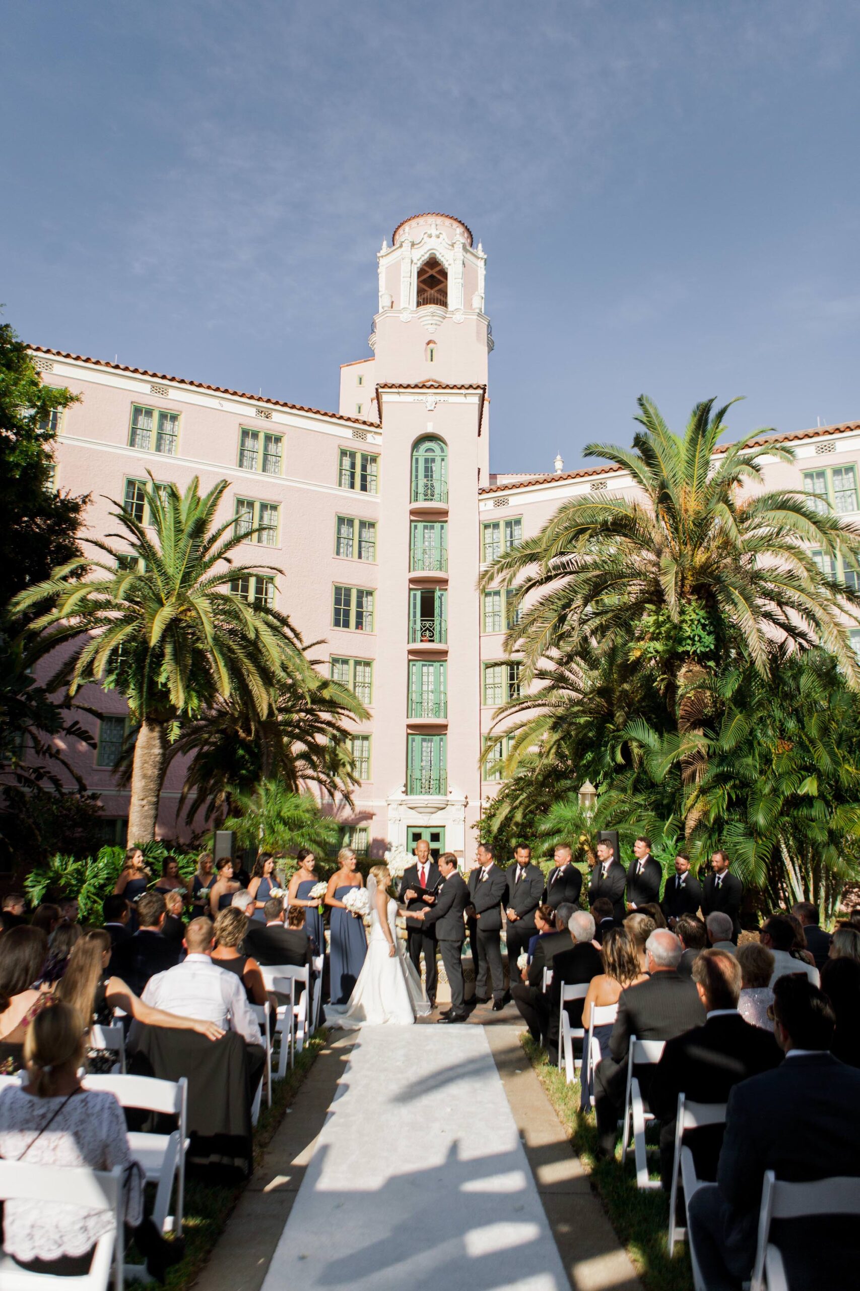 Timeless Classic Bride and Groom Exchanging Wedding Vows During Courtyard Wedding Ceremony | St. Pete Wedding Venue The Vinoy Renaissance