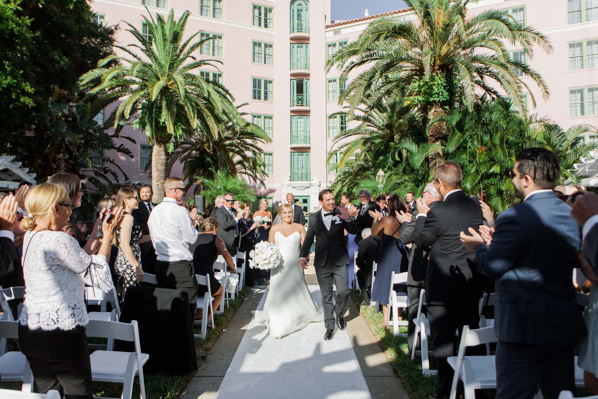 Timeless Classic Bride and Groom Exchanging Wedding Vows During Courtyard Wedding Ceremony | St. Pete Wedding Venue The Vinoy Renaissance