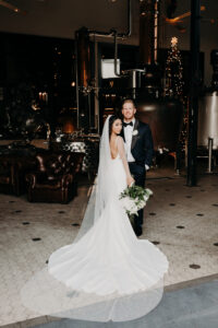 Bride and Groom Wedding Portrait Dark and Moody Industrial Wedding Ceremony | Florida Wedding Venue Urban Stillhouse | Tampa Event Planner Lemon Drops Weddings and Events | Hair and Makeup Michele Renee The Studio