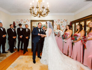 Fairytale Red and Pink Private Residence Wedding, Bride and Groom Exchanging Wedding Vows During Ceremony | Tampa Bay Wedding Photographer Dewitt for Love Photography