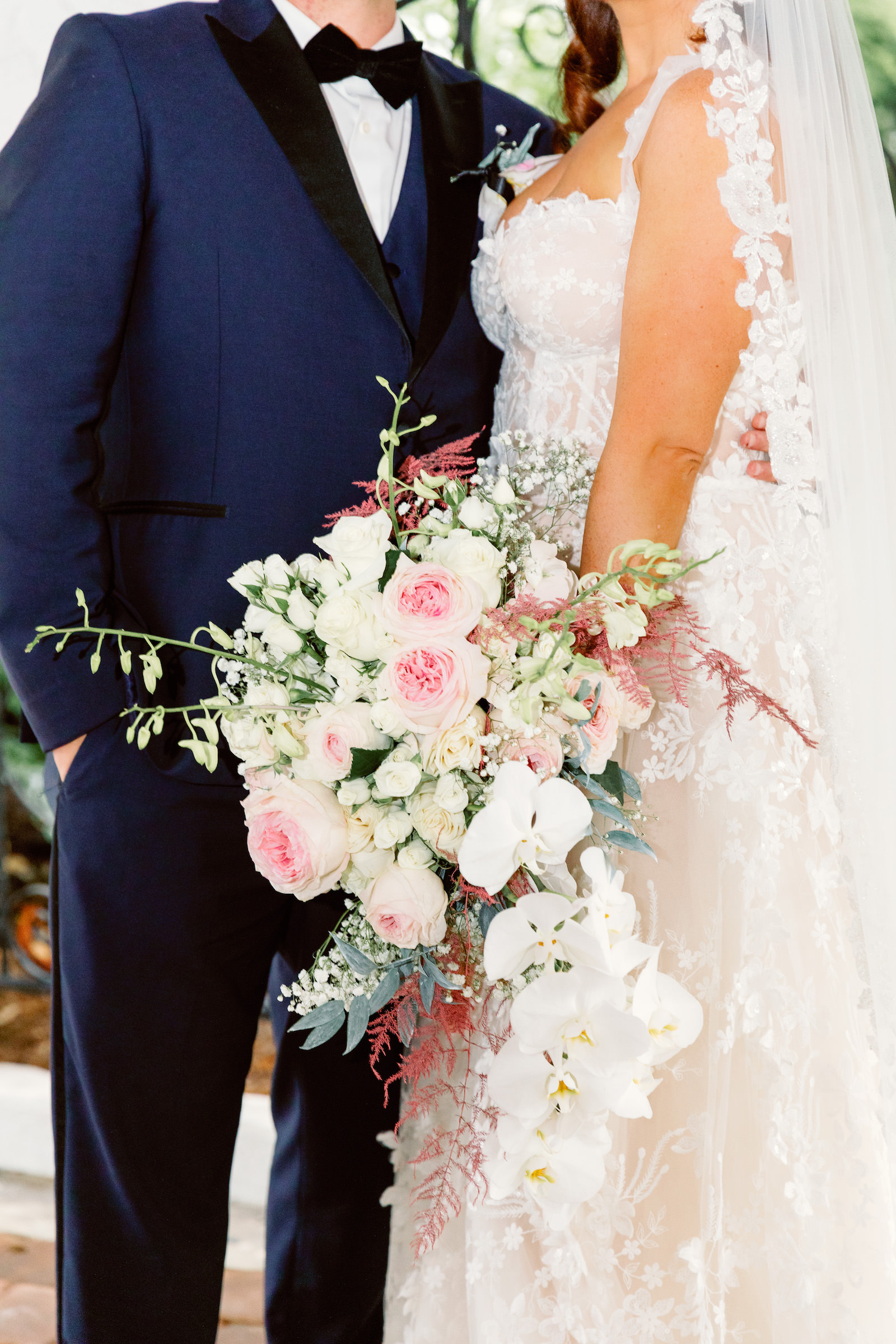 Fairytale Red and Pink Private Residence Wedding, Bride Holding Lush Romantic White Orchid, Pink Roses and Greenery Floral Bouquet | Tampa Bay Wedding Photographer Dewitt for Love | Wedding Florist Lemon Drops