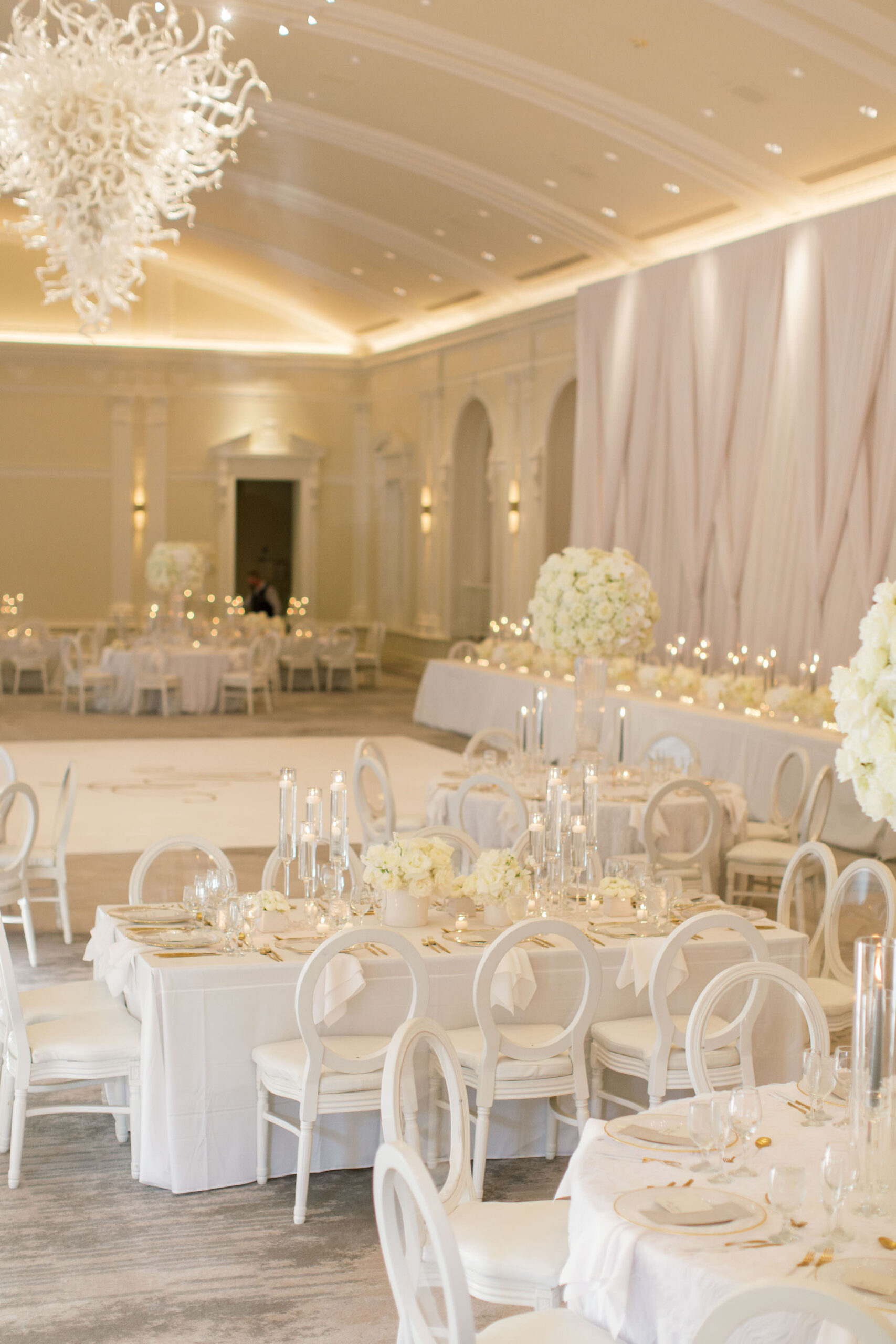 Timeless Classic Wedding Reception Ballroom Decor, Tables with White Linens, Elegant White Dining Chairs, Tall White Orchid Floral Centerpieces, Candlesticks | Tampa Bay Wedding Planner Parties A'la Carte | St. Pete Wedding Venue The Vinoy Renaissance | Wedding Florist Bruce Wayne Florals