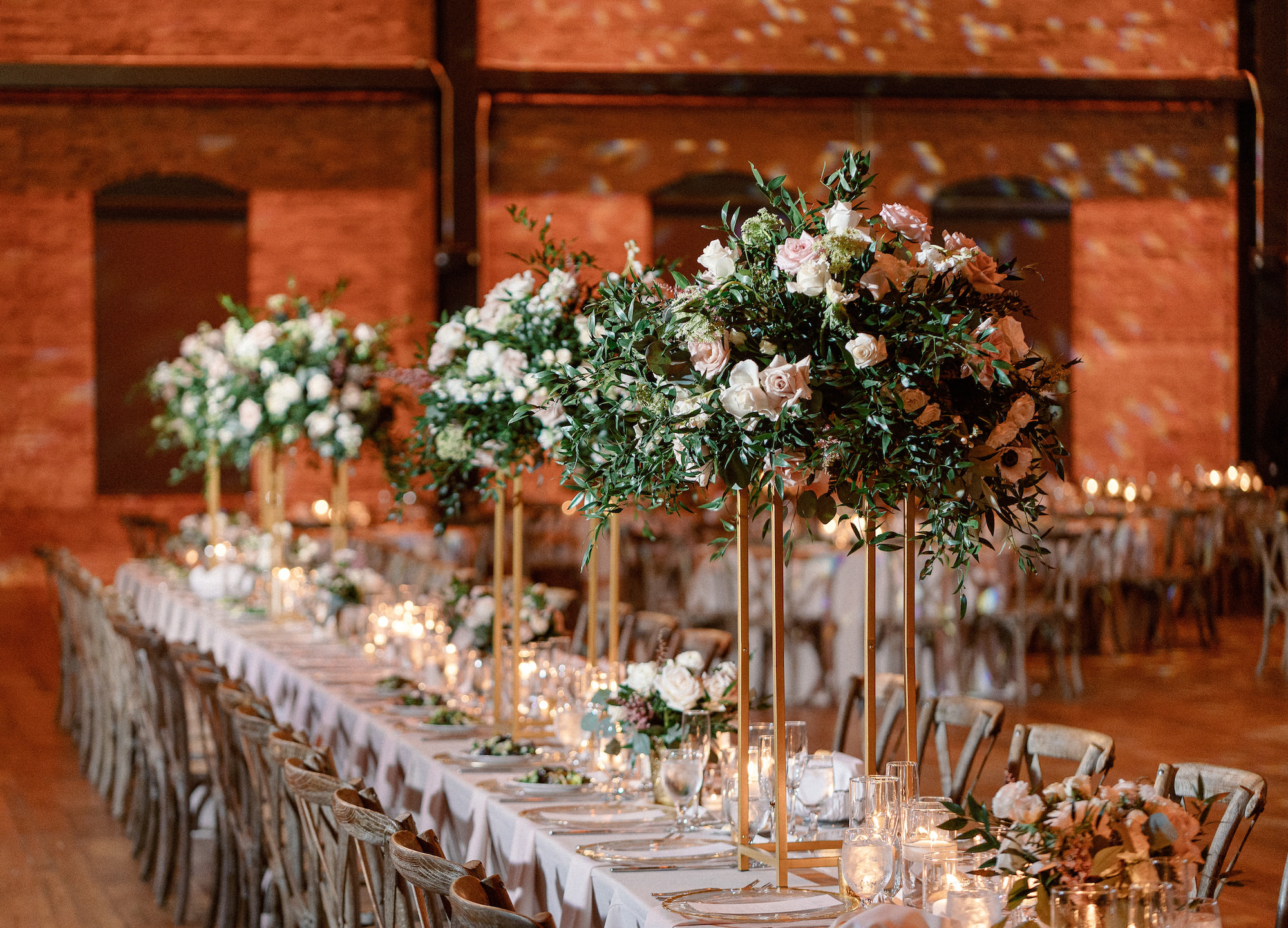 Long Feasting Table Wedding Reception Inspiration | Tall Blush Pink Rose and Greenery and Gold Centerpiece | Spring Wedding Reception Inspiration | Tampa Bay Wedding Venue Armature Works