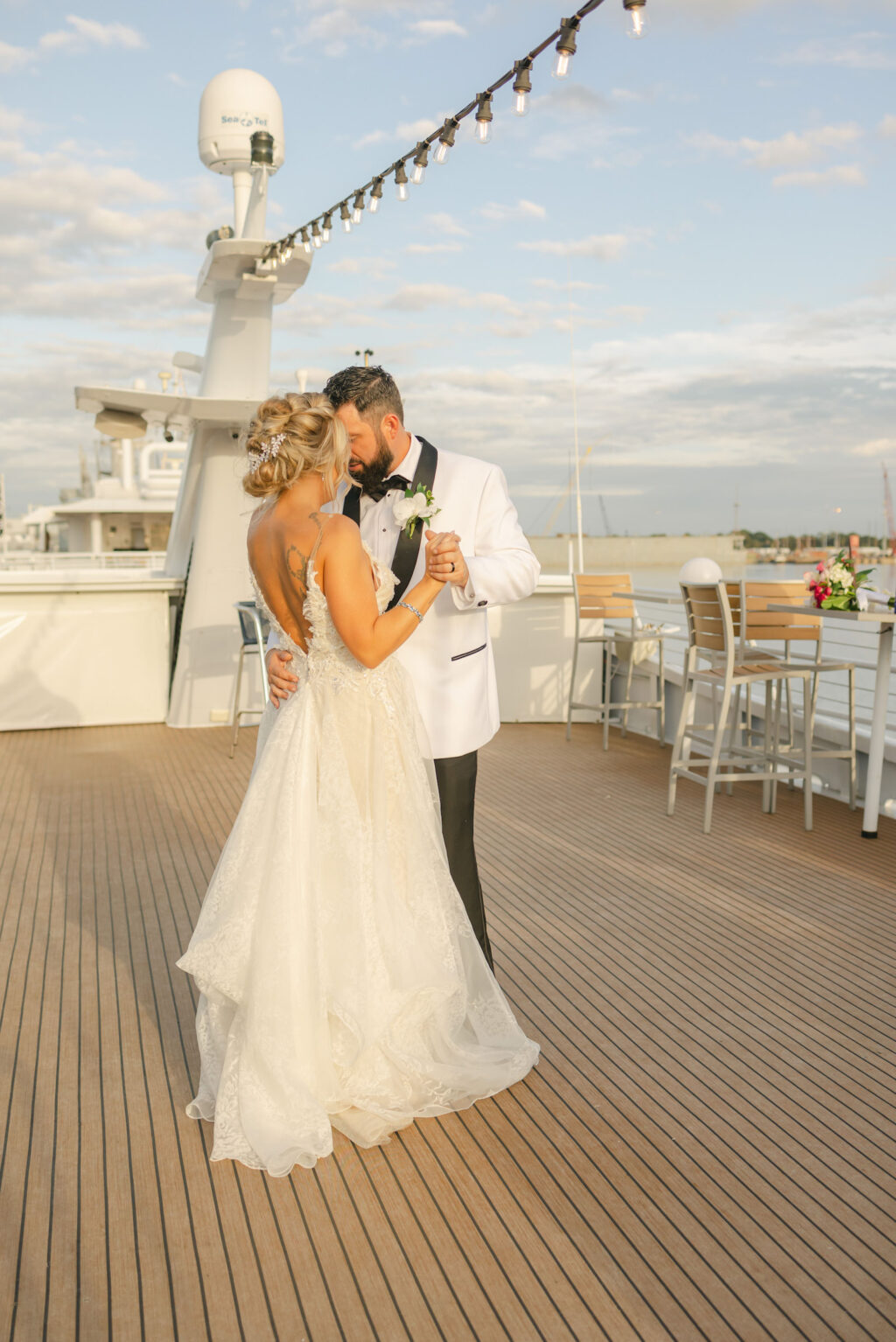Groom Spinning Bride Sunset Wedding Photo | Tampa Bay Wedding Venue Yacht StarShip