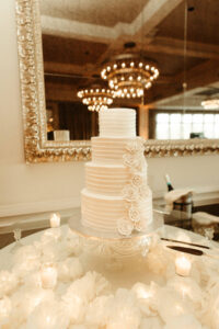 Four Tier Classic white Wedding Cake with White Floral Detailing