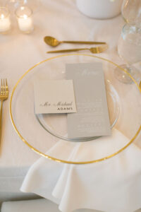 Timeless Classic Wedding Reception Decor, Clear Glass and Gold Rimmed Charger Plate, Gray Menu Stationery, Black and White Cardstock Place Card, Gold Silverware | Tampa Bay Wedding Planner Parties A'la Carte