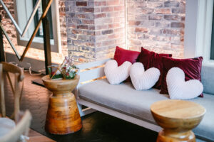 Modern Burgundy and Red Loveseat Couch | Red Mesa St. Pete Reception