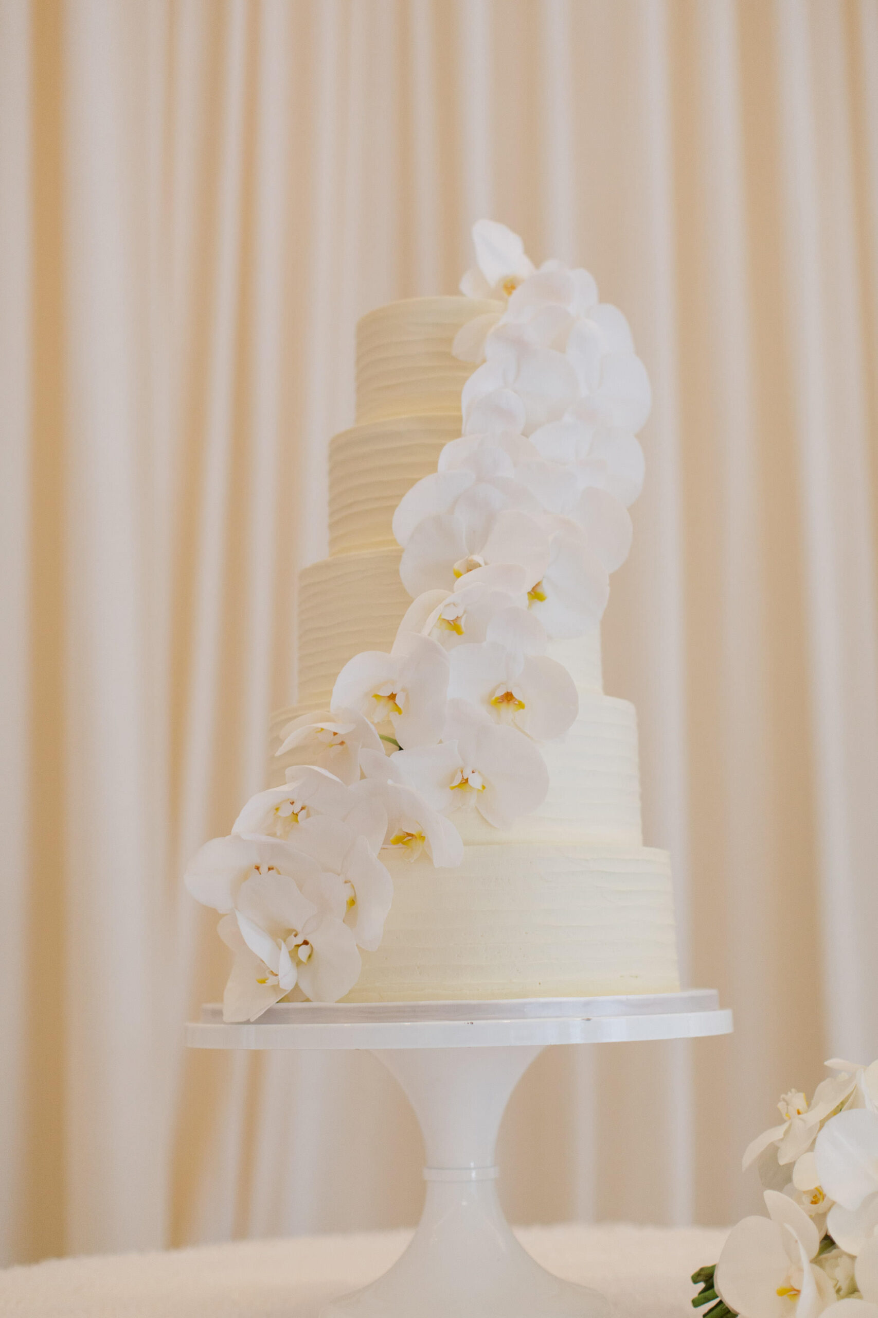 Timeless Classic Wedding Reception, Five Tier Textured White Wedding Cake with Cascading White Orchid Flowers | Tampa Bay Wedding Florist Bruce Wayne Florals