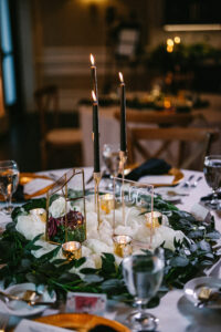 Moody Tablescape with Tea Light Candles and Black Candles in Gold Holders