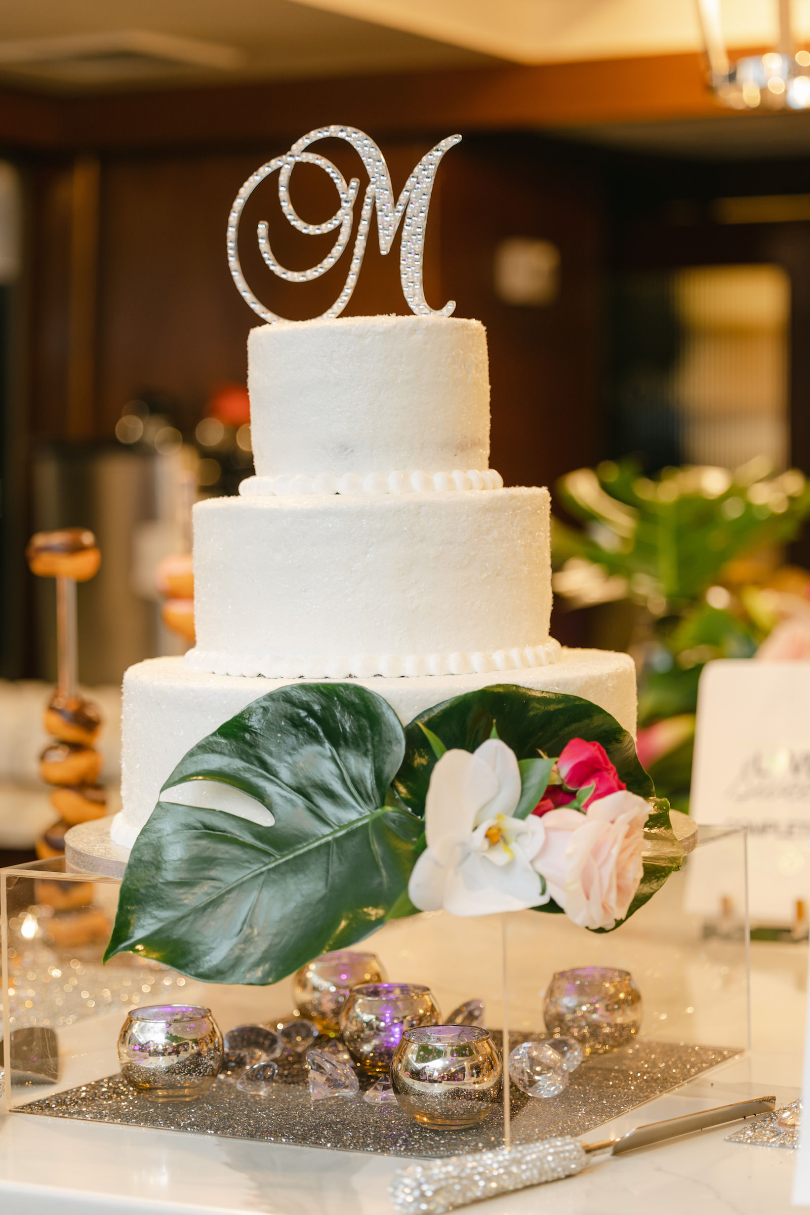 Tropical Modern Wedding Reception, Three Tier White Wedding Cake with Monstera Leaves, White Orchid and Blush Pink Rose