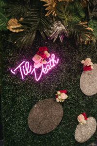 Greenery Hedge Wall with Pink Neon "Til Death" Sign