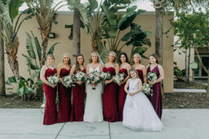 Bride with Bridesmaids in Burgundy Floor Length Bridesmaids Dresses and White Floral Bouquets | Tampa Photographer Amber McWhorter Photography