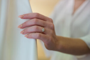 Close Up Ring Shot of Bride Holding Dress | Tampa Wedding Photographer Joyelan Photography