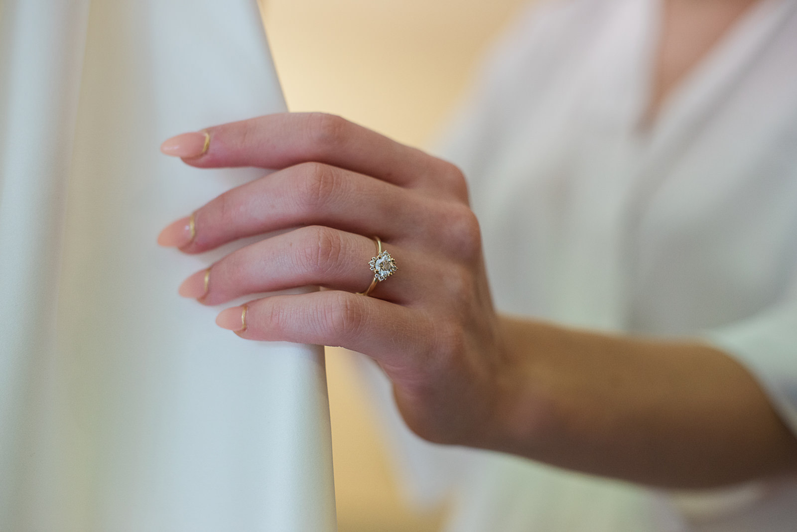 Close Up Ring Shot of Bride Holding Dress | Tampa Wedding Photographer Joyelan Photography
