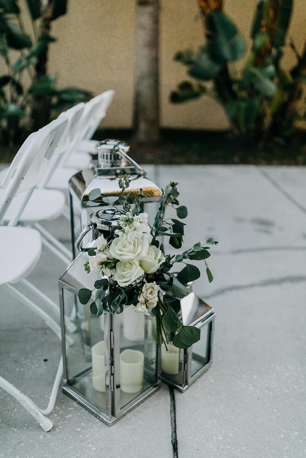 Silver Lanterns with White Florals and Greenery Wedding Aisle Décor | Tampa Wedding Planner Special Moments Event Planning