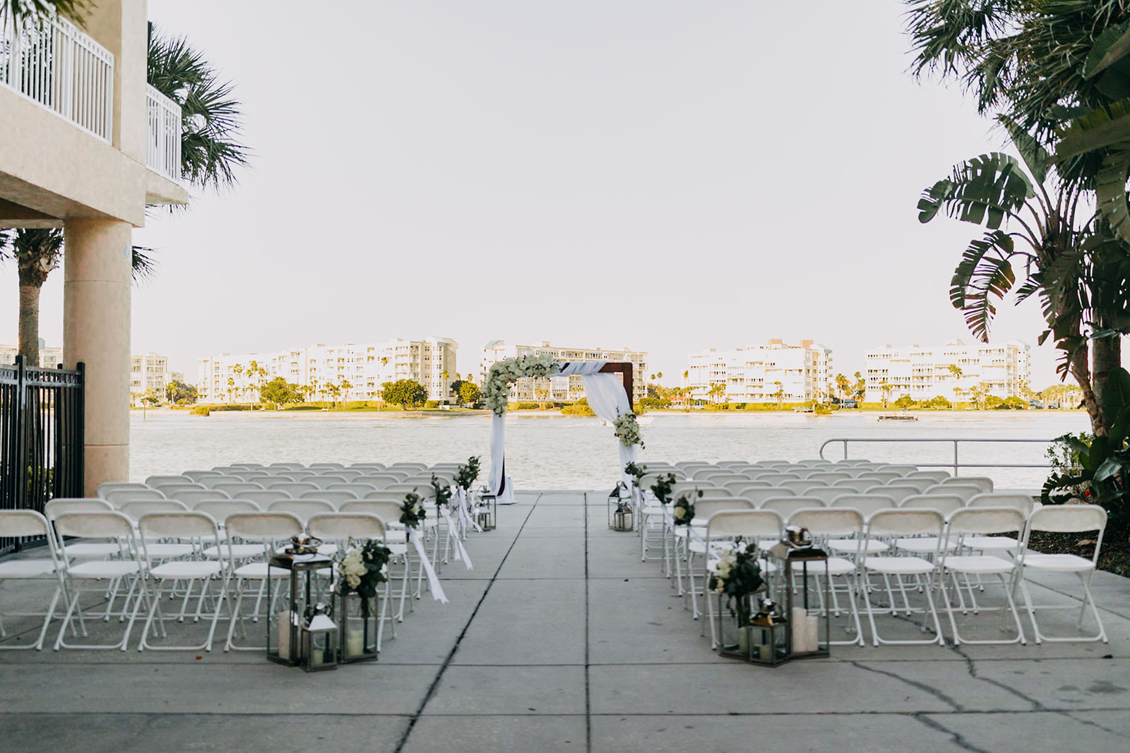 Waterfront Wedding Ceremony with White Florals | Florida Waterfront Wedding Venue with St. Petersburg Wedding Planner Special Moments Event Planning