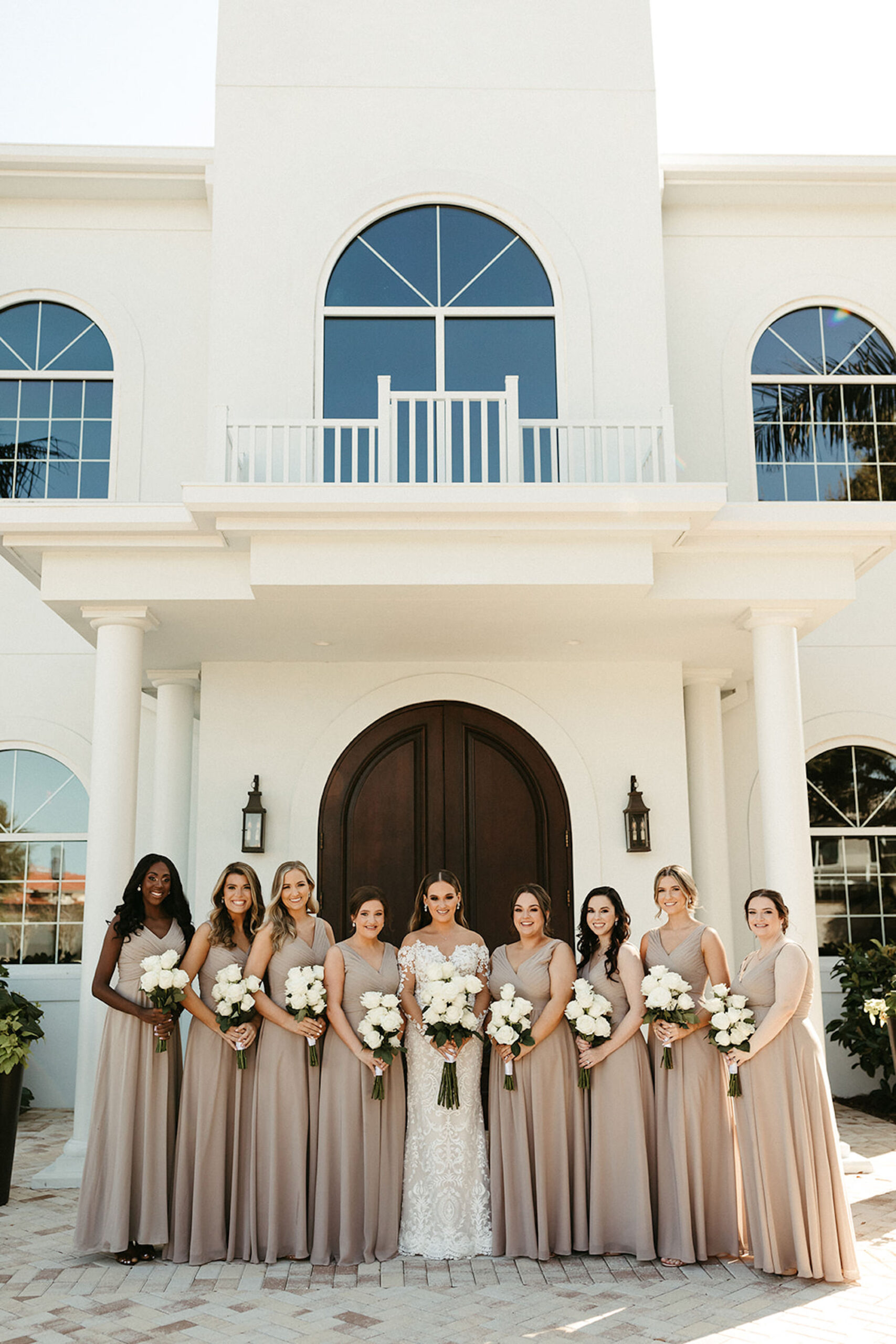 Bride with Bridesmaids in Taupe Floor Length Bridesmaids Dresses | Harborside Chapel in St. Petersburg Florida Wedding Ceremony